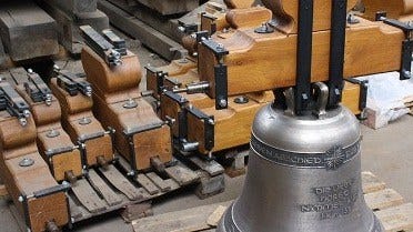 Bronze bell complete with wooden yoke